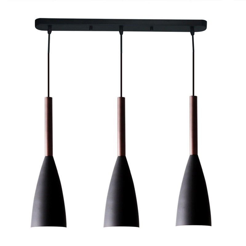 Trine triple aluminium pendant light in white above a kitchen island with adjustable cord lengths