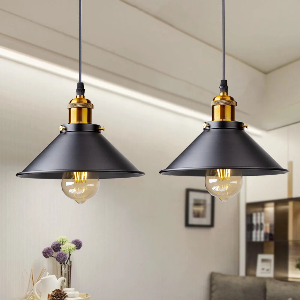 Camden vintage loft pendant light in black metal finish hanging above a kitchen dining table