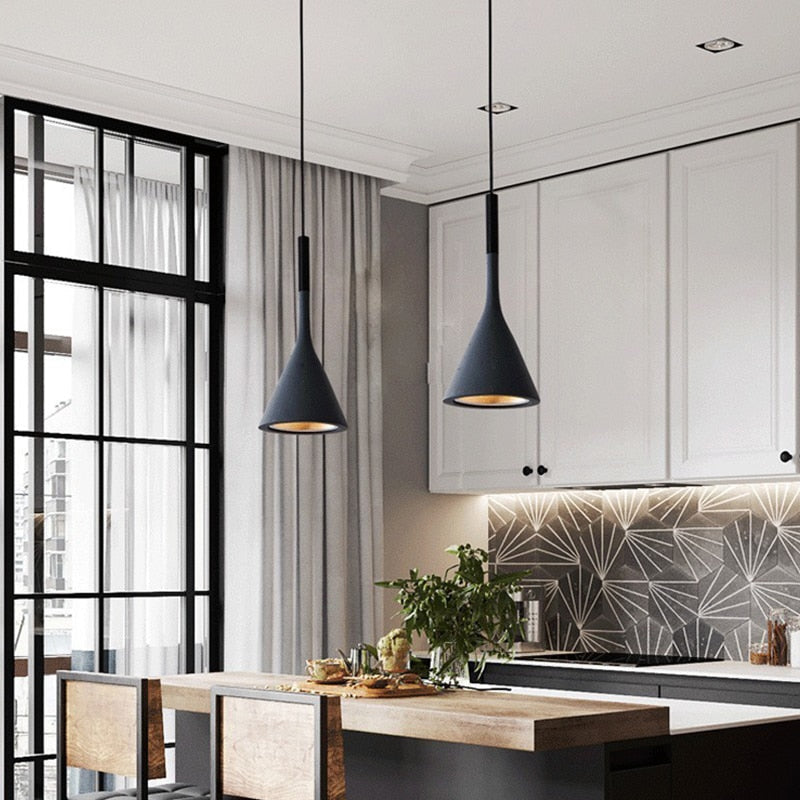 Moderna black aluminium Nordic pendant light with adjustable cord above a kitchen island