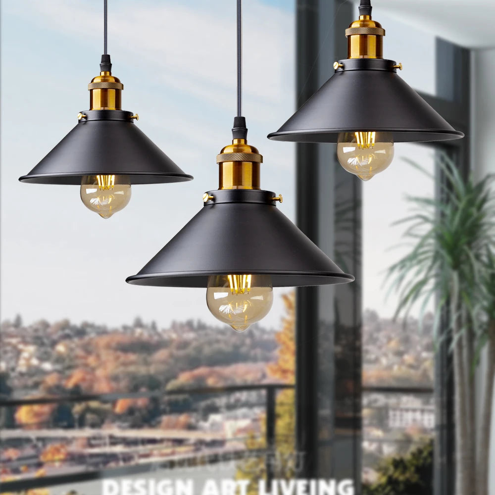 Camden vintage loft pendant light in black metal finish hanging above a kitchen dining table