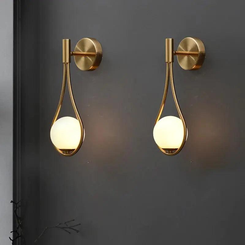 Livi II black Nordic wall sconce mounted on a dark papered wall in a hallway