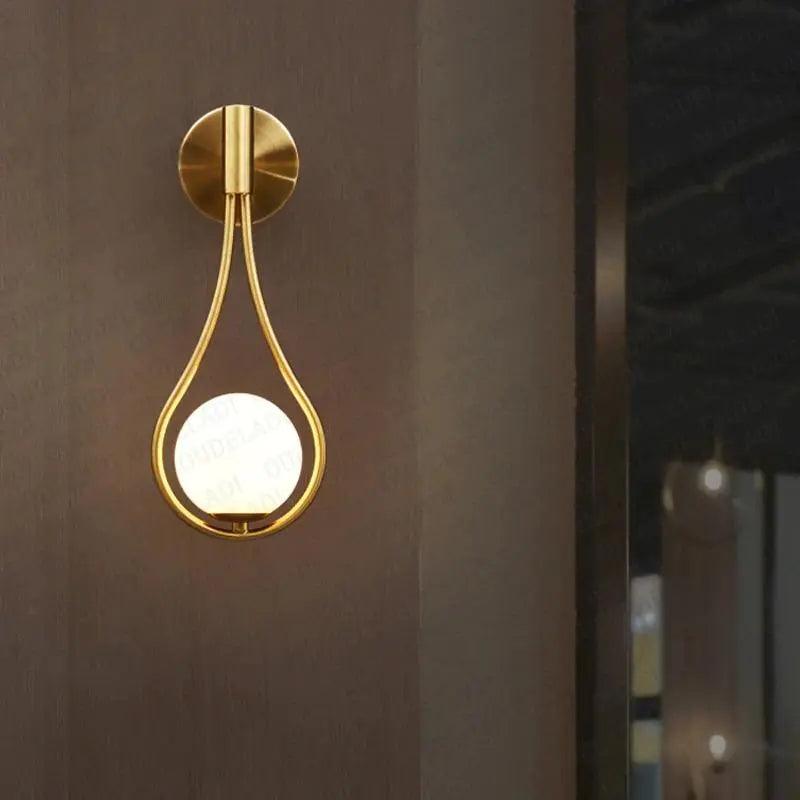 Livi II black Nordic wall sconce mounted on a dark papered wall in a hallway