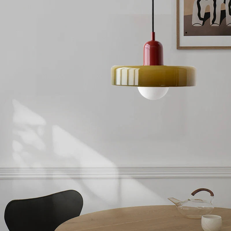 Kalle beige and white Bauhaus dual-tone glass pendant light hanging above a dining table
