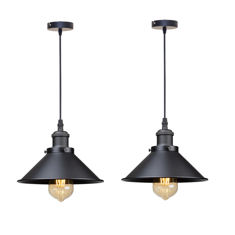 Camden vintage loft pendant light in black metal finish hanging above a kitchen dining table