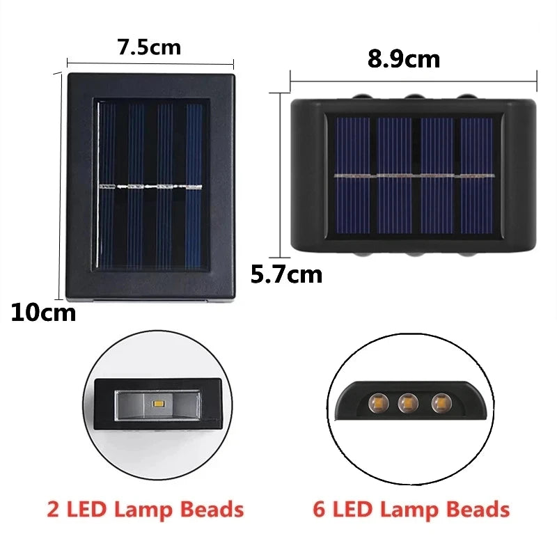Solstice solar wall light mounted on a garden fence, illuminated at dusk