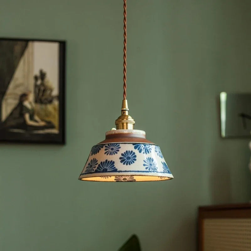 Ronja hand-painted blue floral ceramic pendant light hanging above a kitchen dining nook