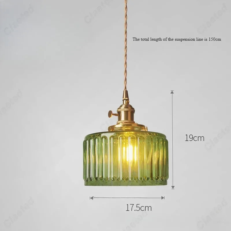 Vessel vintage glass wall lamp mounted beside a bedroom window casting warm ambient light