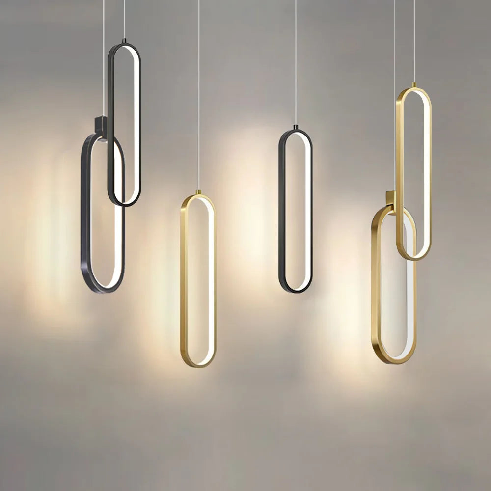 Arlo minimalist aluminium bar pendant light in matte black, hanging above a kitchen island