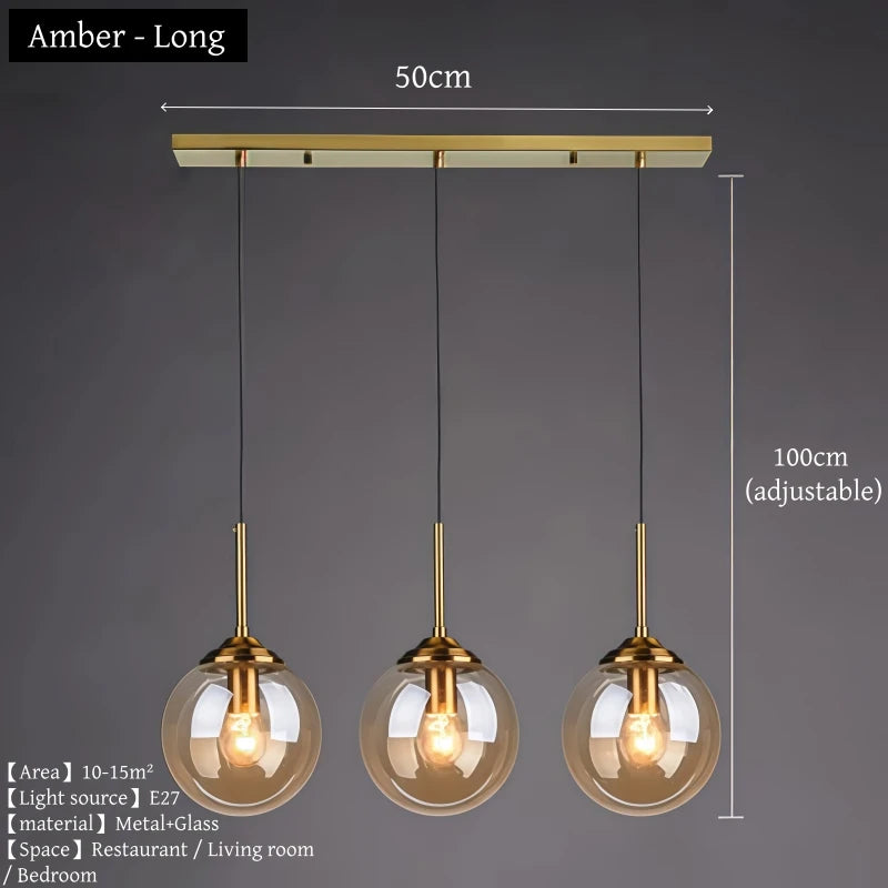 Orla amber glass and metal pendant light hanging above a bedside table in a Nordic-style bedroom