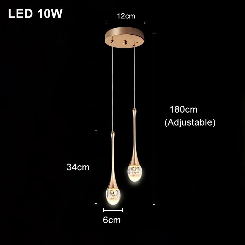 Dewdrop crystal cluster pendant light with multiple glass spheres hanging above a dining table