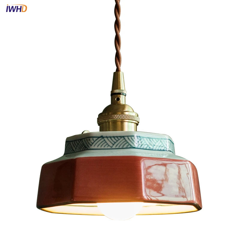 Kensington hand-painted red ceramic pendant light with copper fitting in a dining room