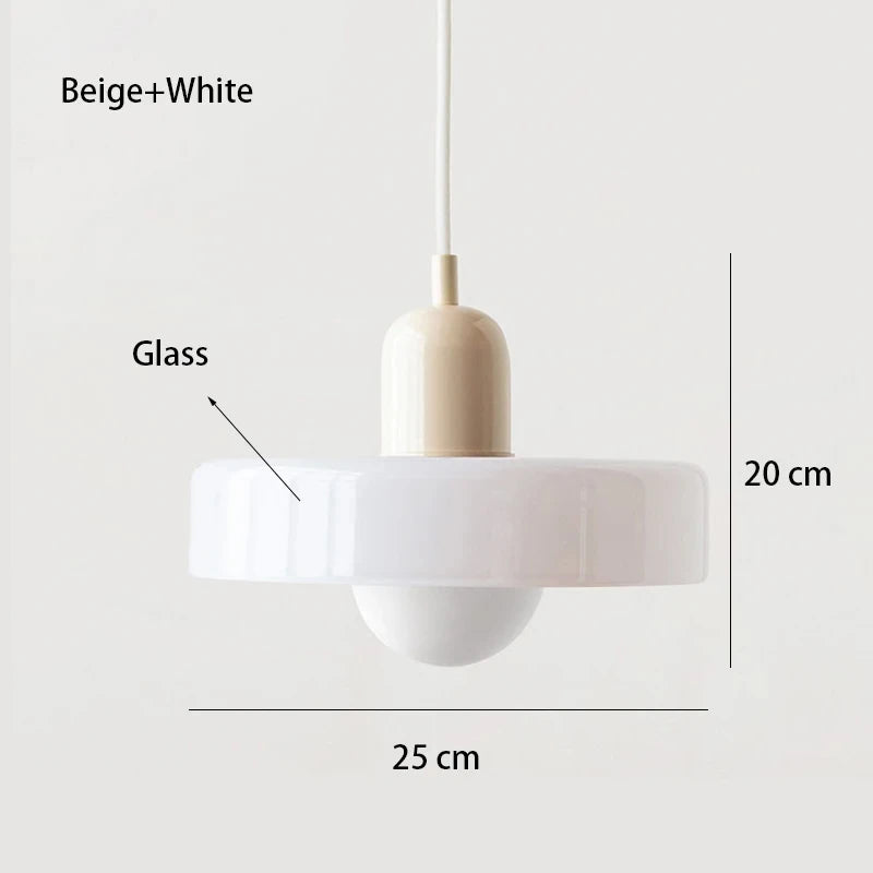 Bauhaus multi-pendant glass chandelier with orange shades hanging above a dining table in a café