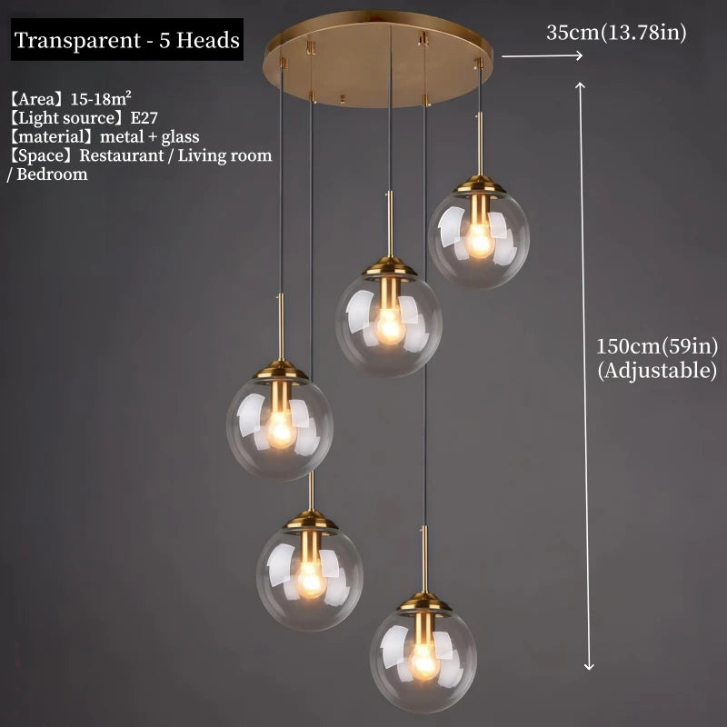 Orla amber glass and metal pendant light hanging above a bedside table in a Nordic-style bedroom
