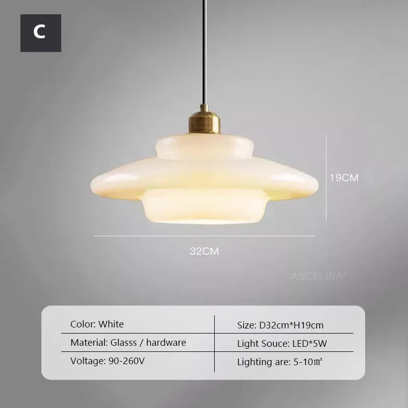 Opal milk glass pendant light hanging above a dining table, casting a soft warm glow