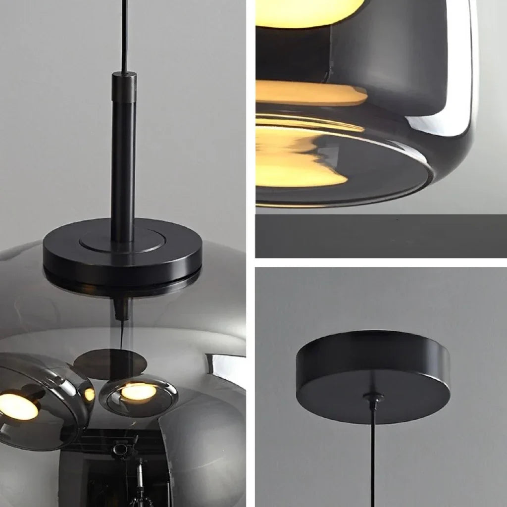 Astrid amber glass Nordic pendant light with gold fitting above a dining table