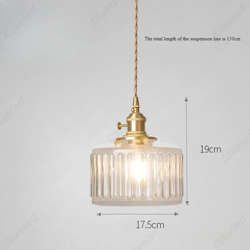 Vessel vintage glass wall lamp mounted beside a bedroom window casting warm ambient light