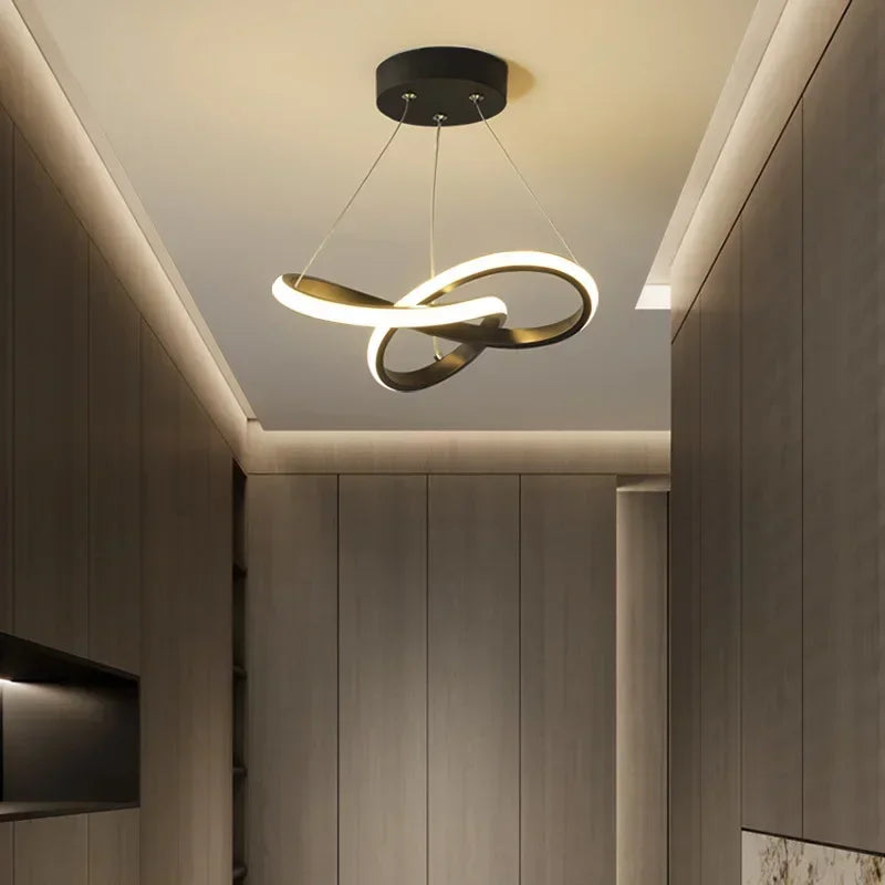 Strand slim Nordic LED ceiling pendant in white hanging in a dining room with low ceiling