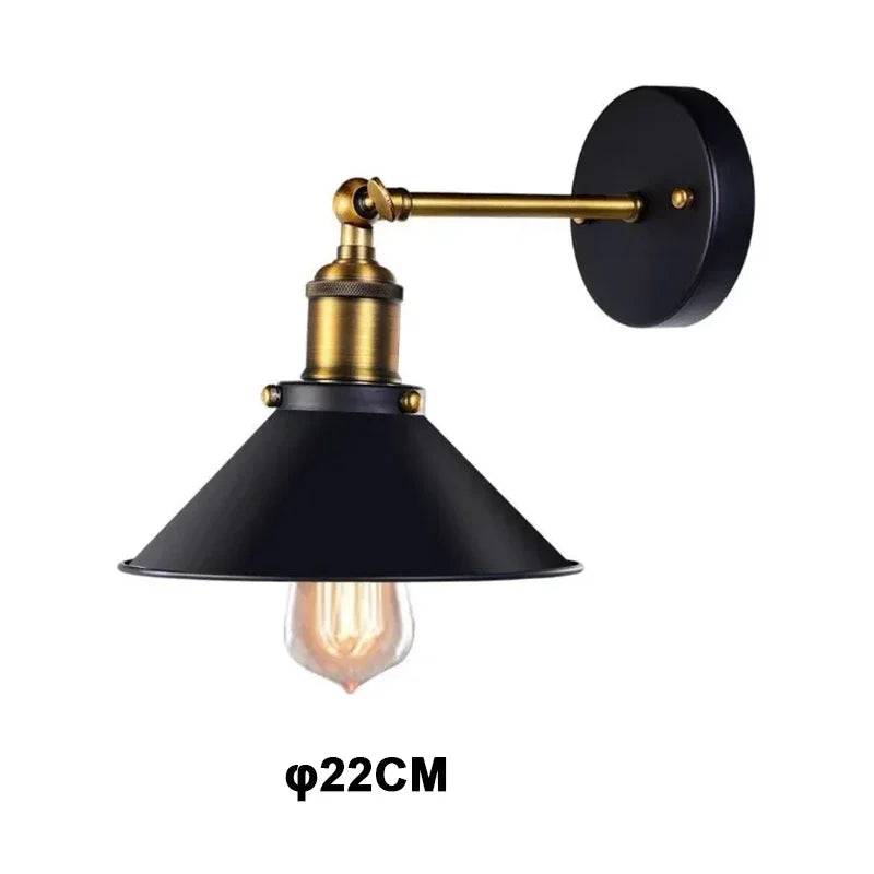 Edison industrial iron wall lamp in matte black mounted on a brick staircase wall