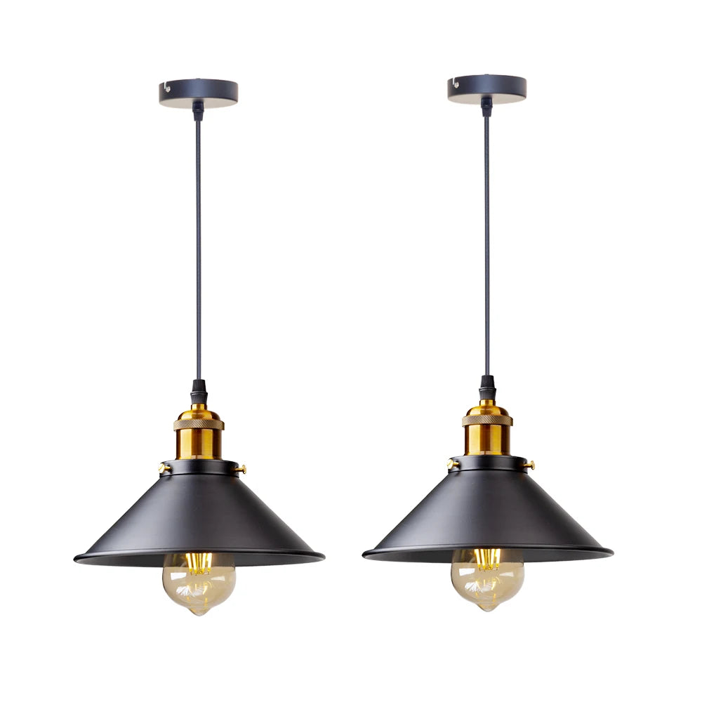 Camden vintage loft pendant light in black metal finish hanging above a kitchen dining table