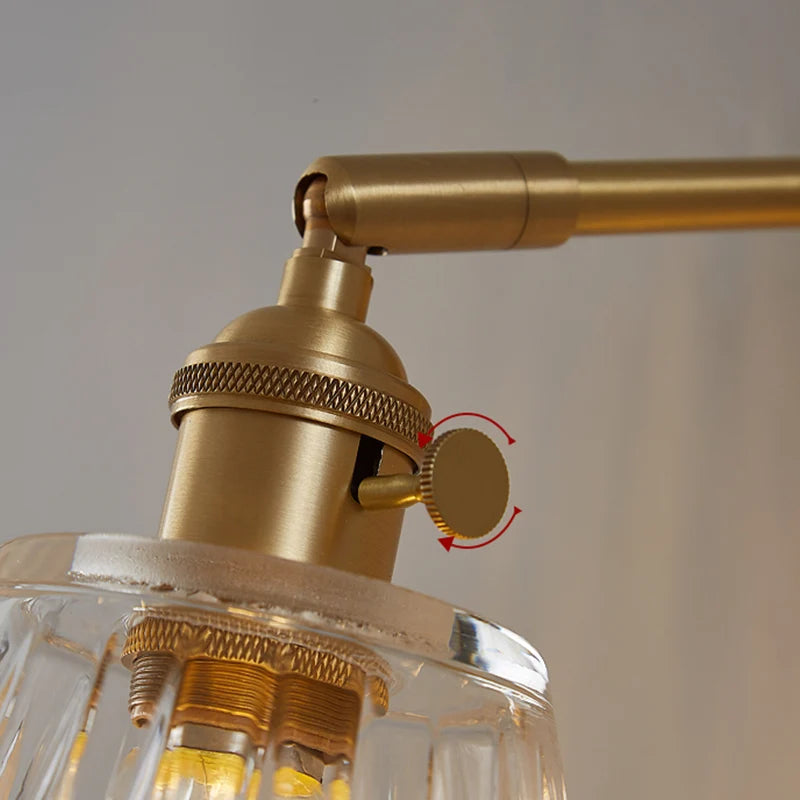 Kyoto brass and glass wall lamp mounted beside a bathroom mirror casting warm light