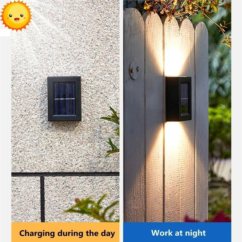 Solstice solar wall light mounted on a garden fence, illuminated at dusk