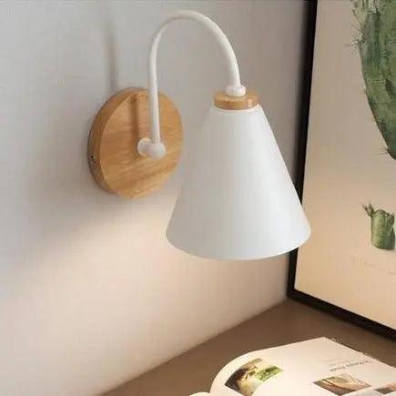 Saskia Nordic wall lamp in black with opal glass shade mounted in a contemporary bedroom