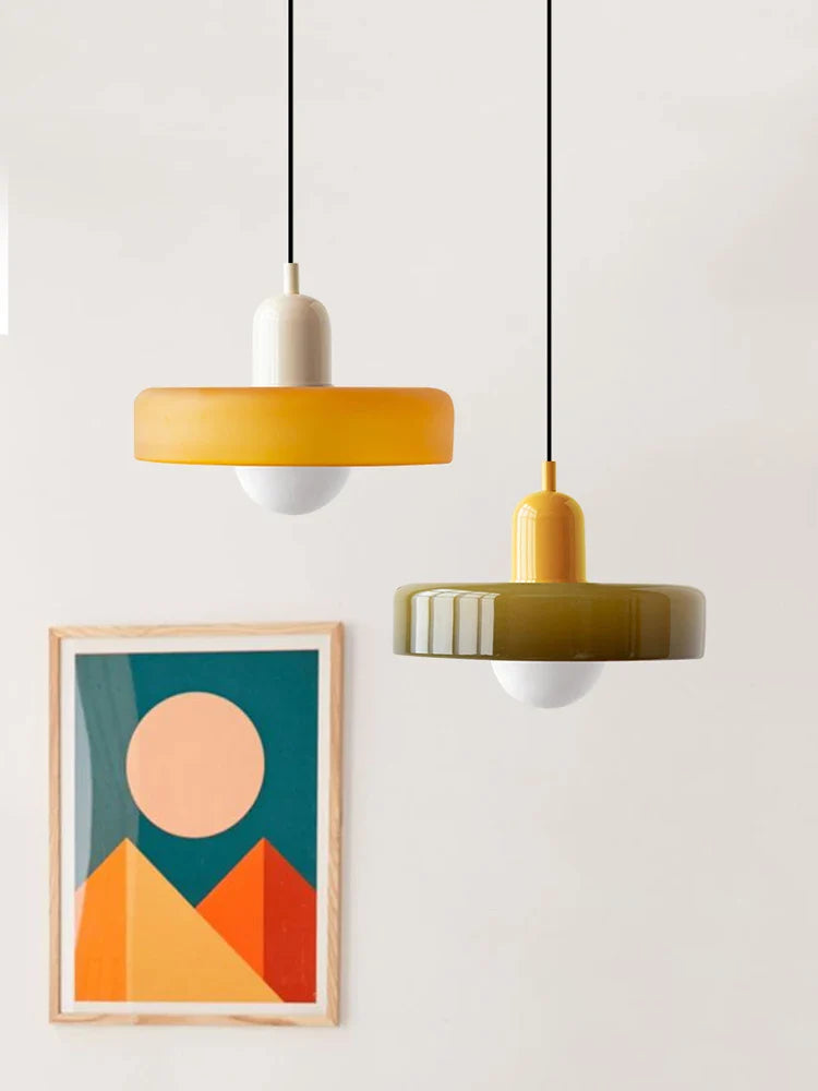 Kalle beige and white Bauhaus dual-tone glass pendant light hanging above a dining table