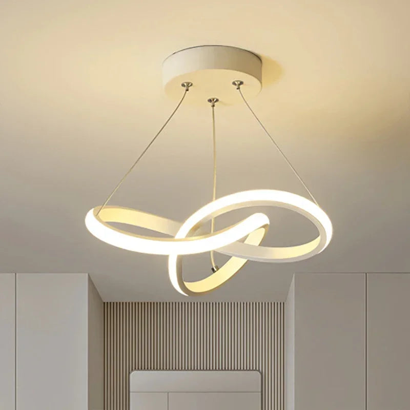 Strand slim Nordic LED ceiling pendant in white hanging in a dining room with low ceiling