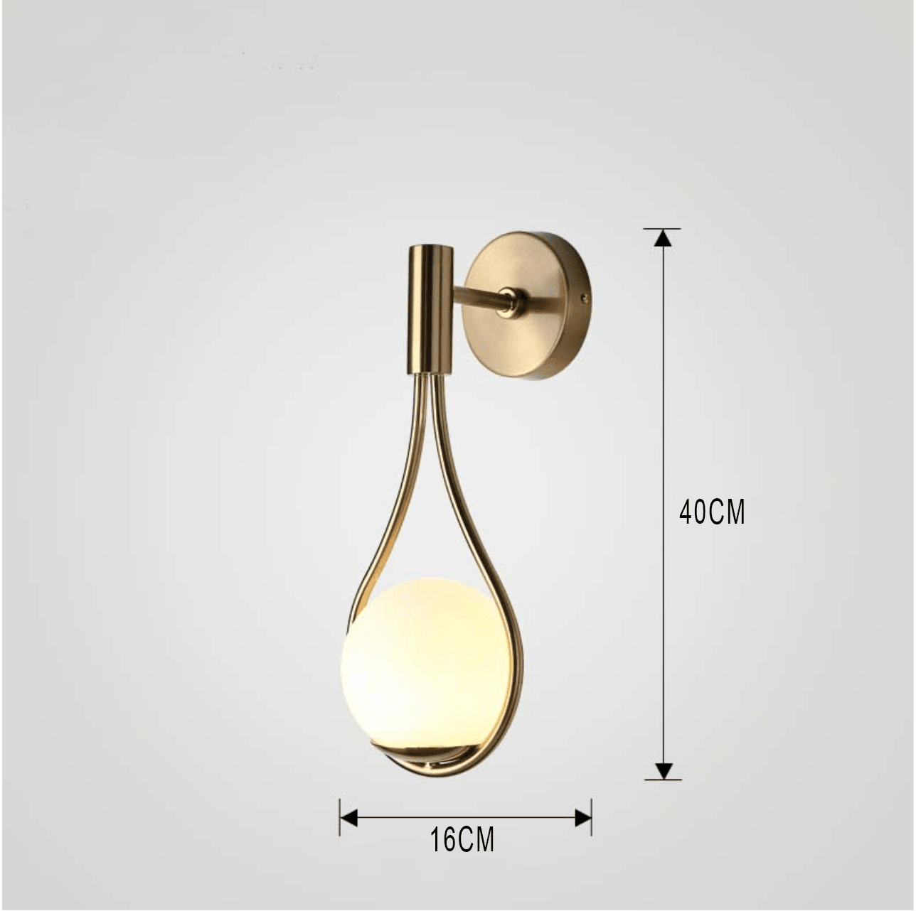 Livi gold Nordic wall sconce mounted beside a bed in a minimalist bedroom