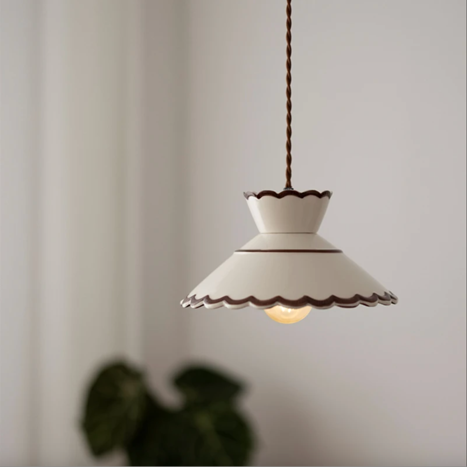 Ronja hand-painted blue floral ceramic pendant light hanging above a kitchen dining nook
