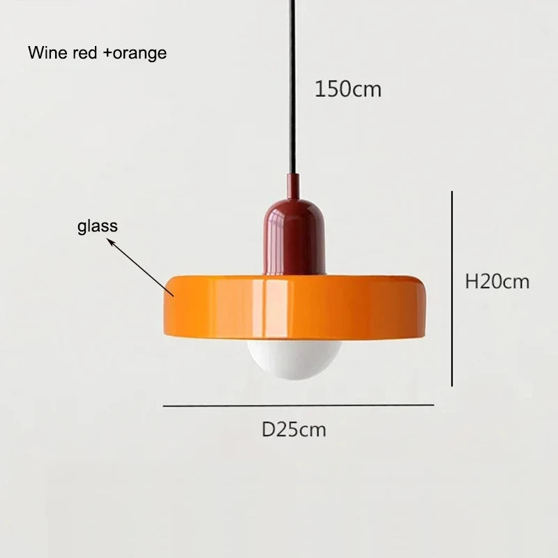Bauhaus multi-pendant glass chandelier with orange shades hanging above a dining table in a café