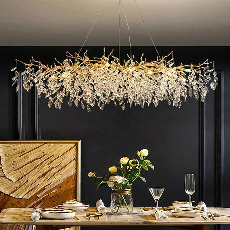 Aurelius brushed gold crystal LED chandelier hanging in a formal dining room