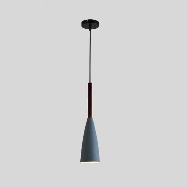Trine triple aluminium pendant light in white above a kitchen island with adjustable cord lengths