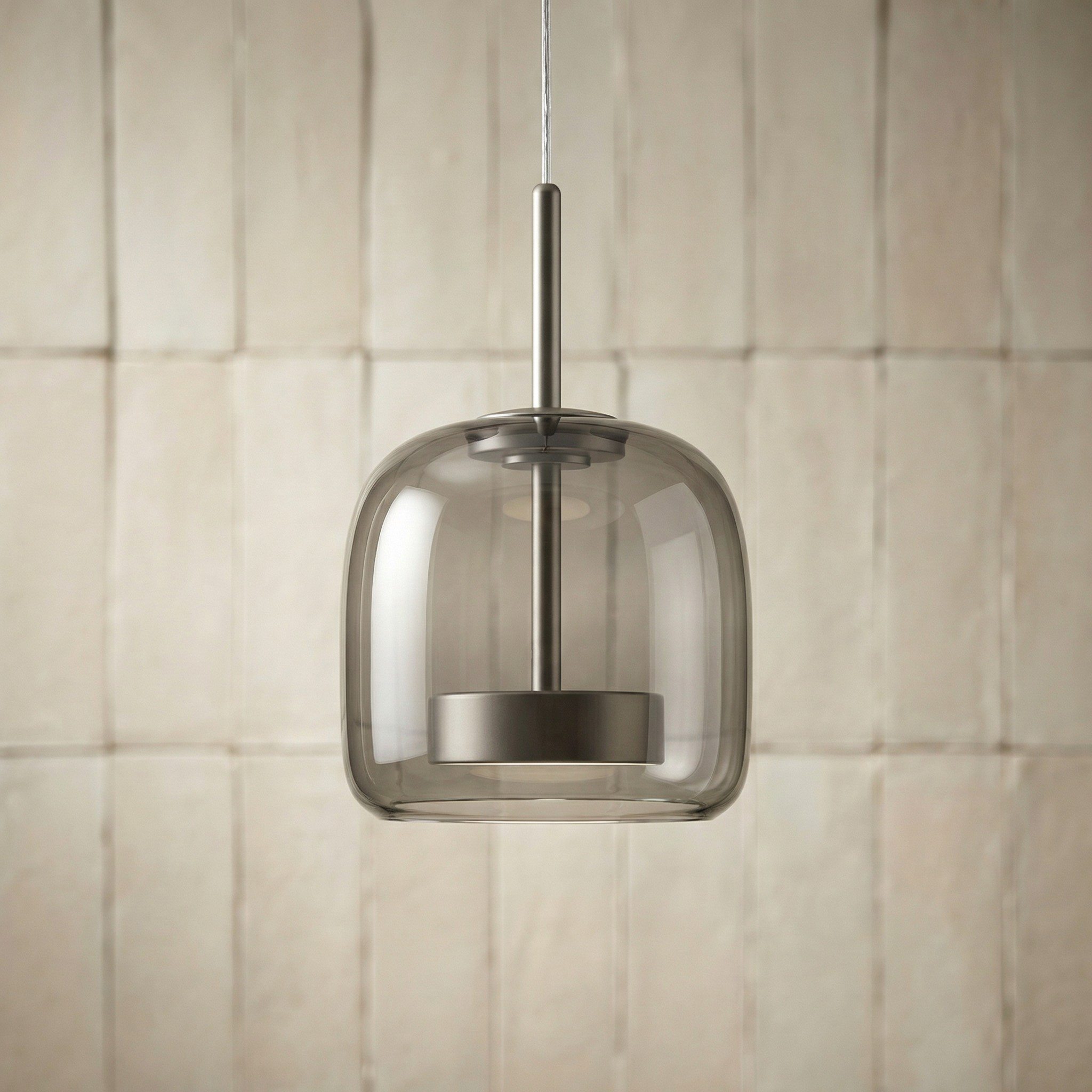 Astrid amber glass Nordic pendant light with gold fitting above a dining table