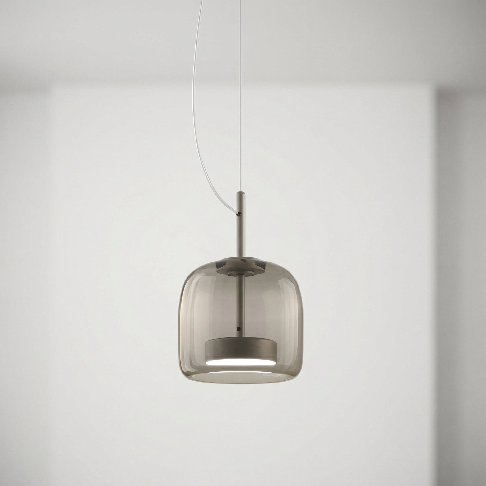 Astrid amber glass Nordic pendant light with gold fitting above a dining table
