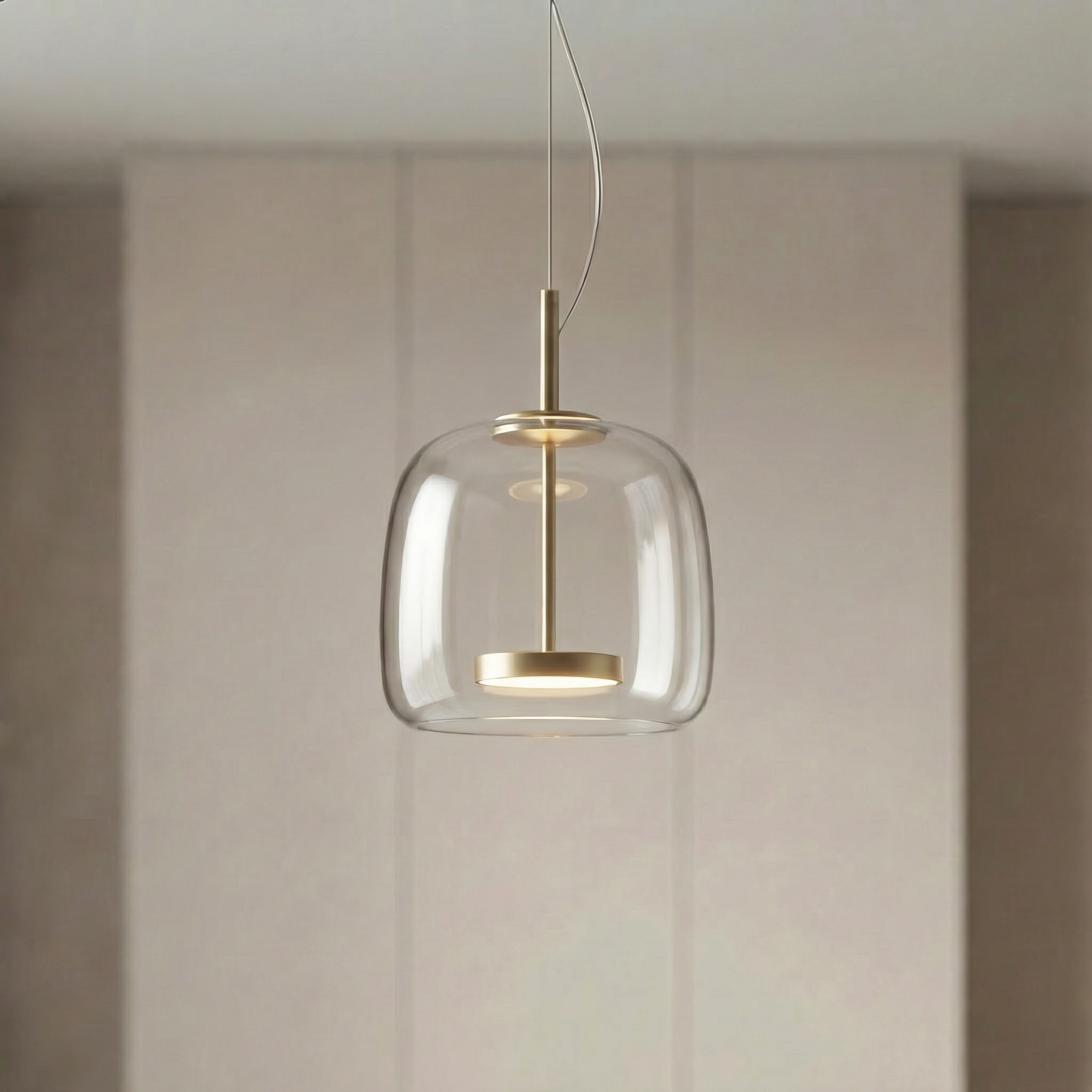 Astrid amber glass Nordic pendant light with gold fitting above a dining table