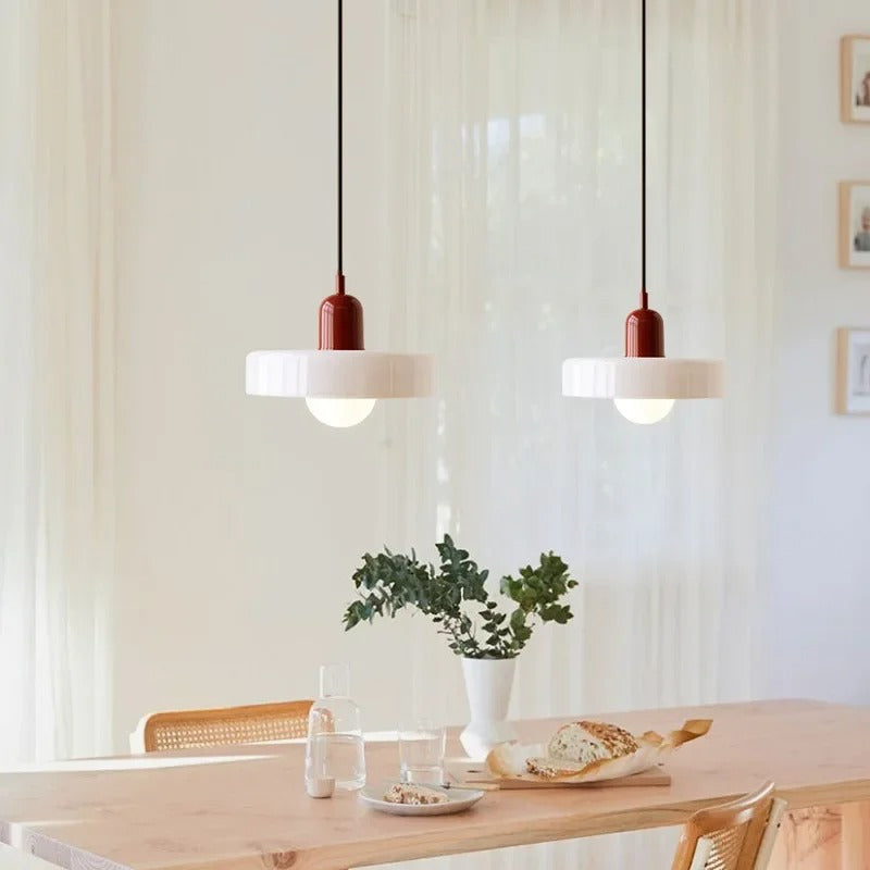 Kalle beige and white Bauhaus dual-tone glass pendant light hanging above a dining table