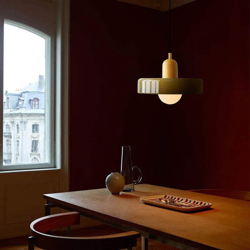 Kalle beige and white Bauhaus dual-tone glass pendant light hanging above a dining table