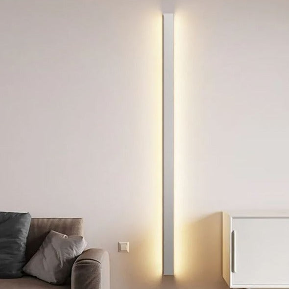 Simplicity minimalist white aluminium pendant light hanging in a Scandinavian living room