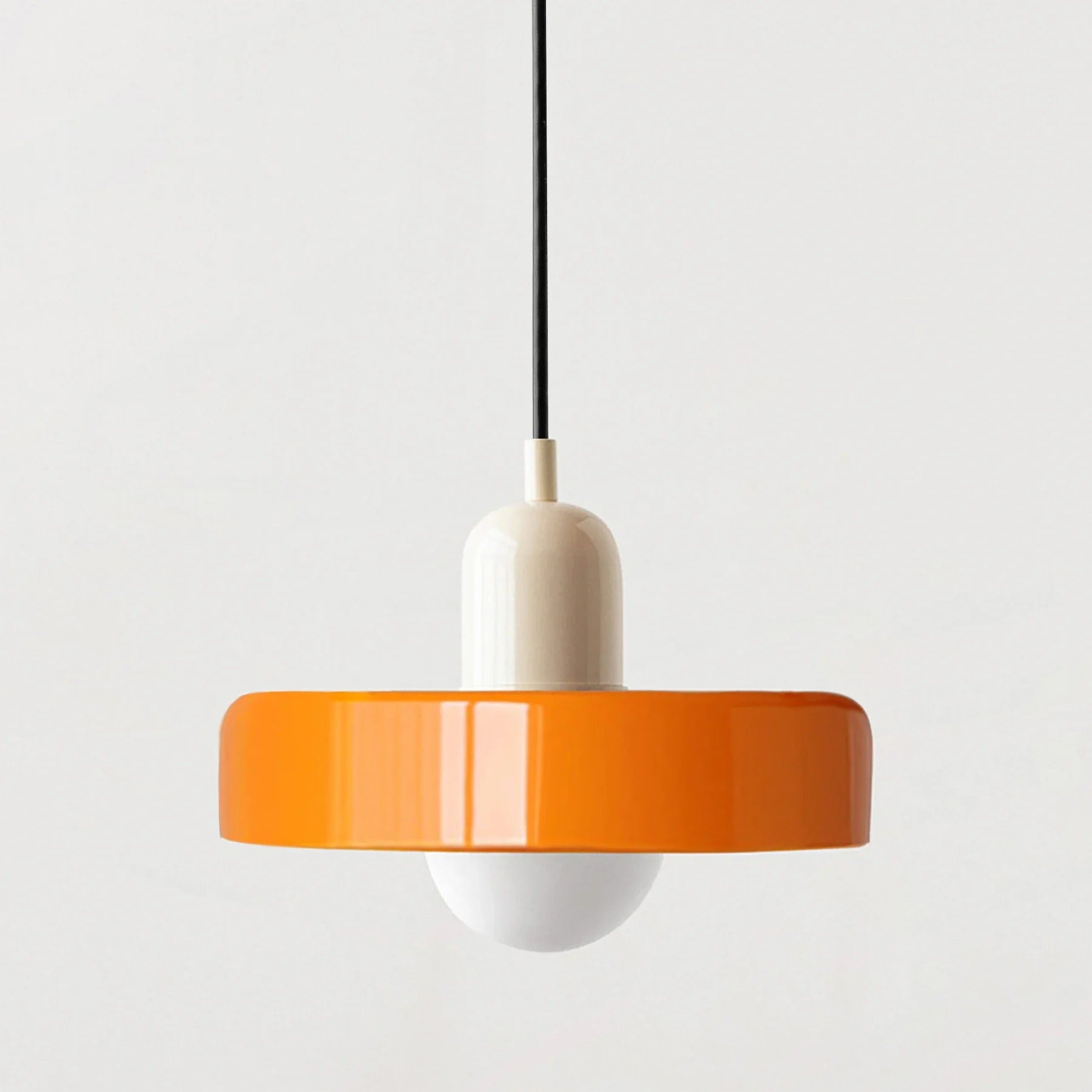 Kalle beige and white Bauhaus dual-tone glass pendant light hanging above a dining table