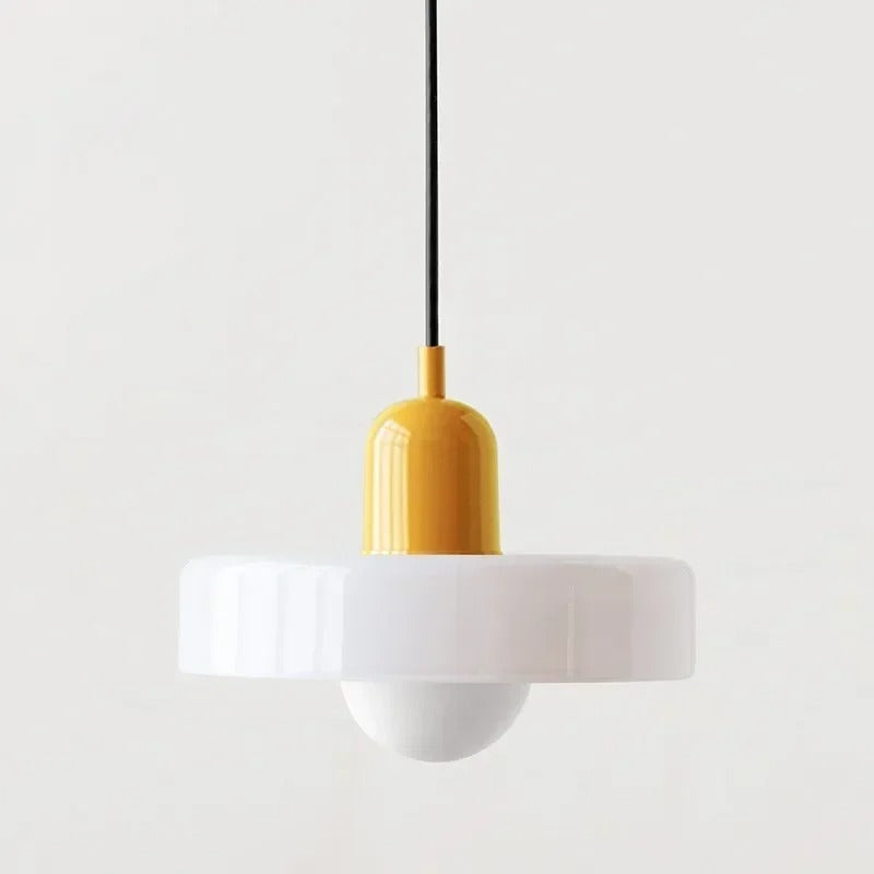 Kalle beige and white Bauhaus dual-tone glass pendant light hanging above a dining table